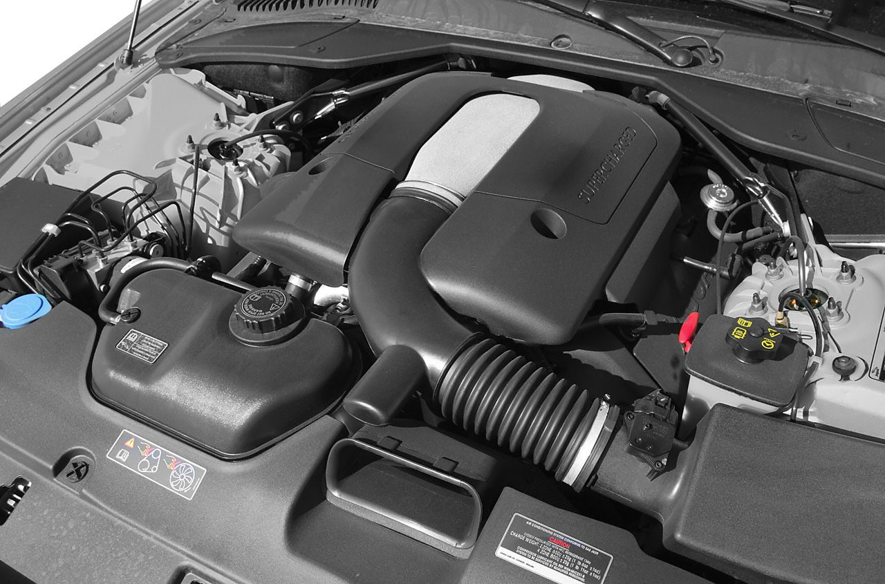 Supercharged engine with air intake and engine cover