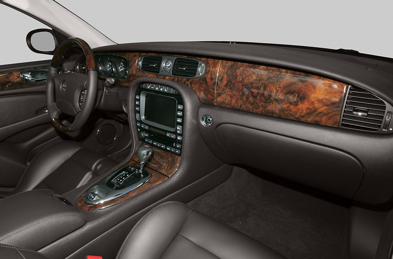 Wood-trimmed luxury dashboard with center console and leather seats