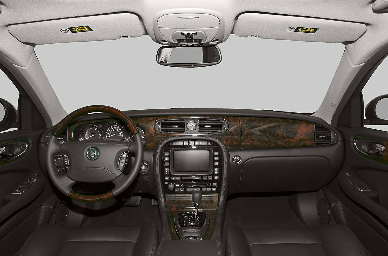 Luxury interior with wood trim dashboard and central console