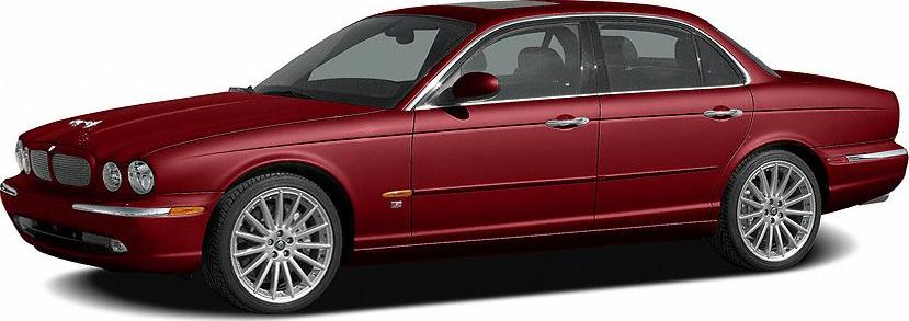 Red luxury sedan with chrome grille and round headlights