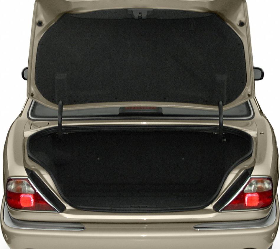 Open trunk space with rear tail lights and trunk lid raised