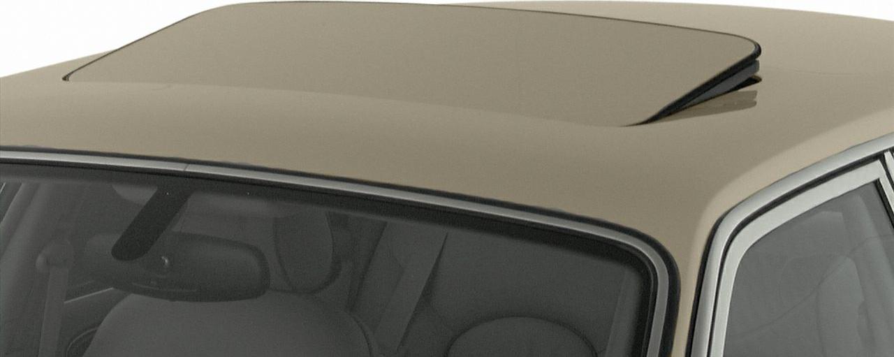 Open sunroof panel on vintage luxury sedan roof