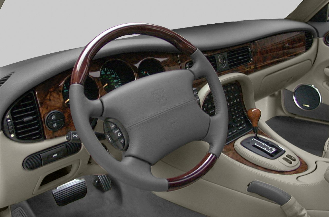 Leather steering wheel with wood trim and wood-accented dashboard interior