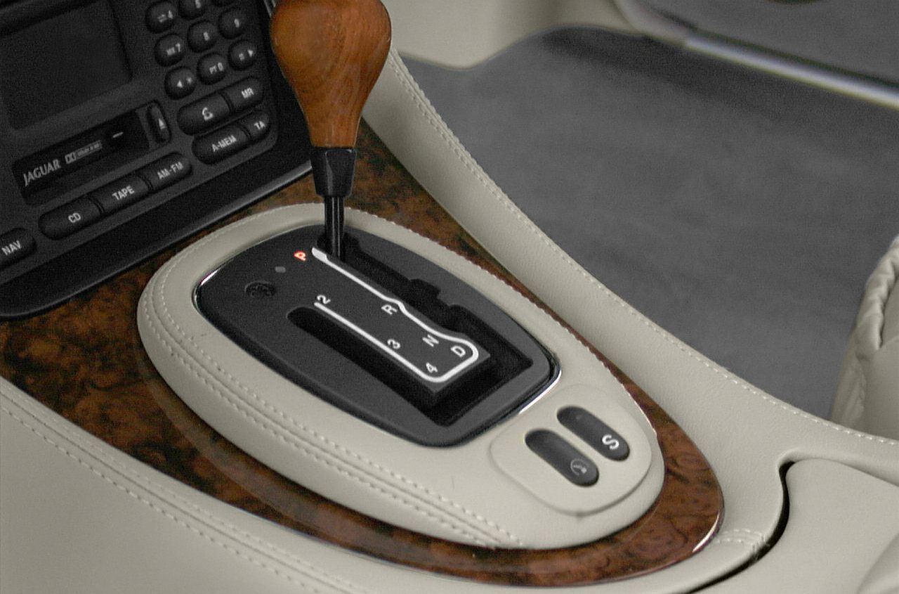 Automatic gear shift lever with wooden knob and wooden trim on center console