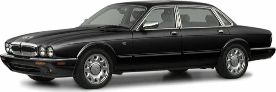 Luxury sedan with quad round headlights and chrome window trim