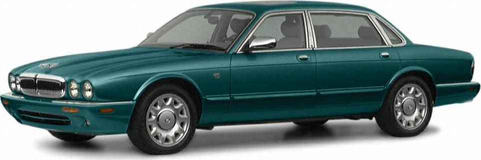 Sedan with four round headlights and chrome grille, four-door body.
