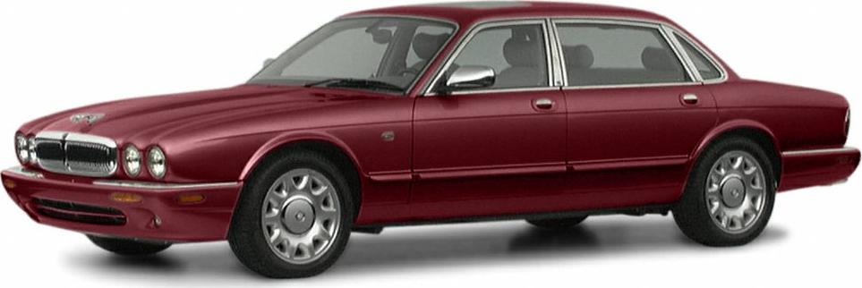 Luxury sedan with quad round headlights, chrome grille, and alloy wheels