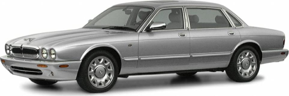 Luxury sedan with rounded quad headlights and chrome grille in a sleek side profile.