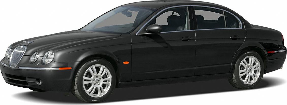 Sleek black sedan with quad round headlights and chrome grille