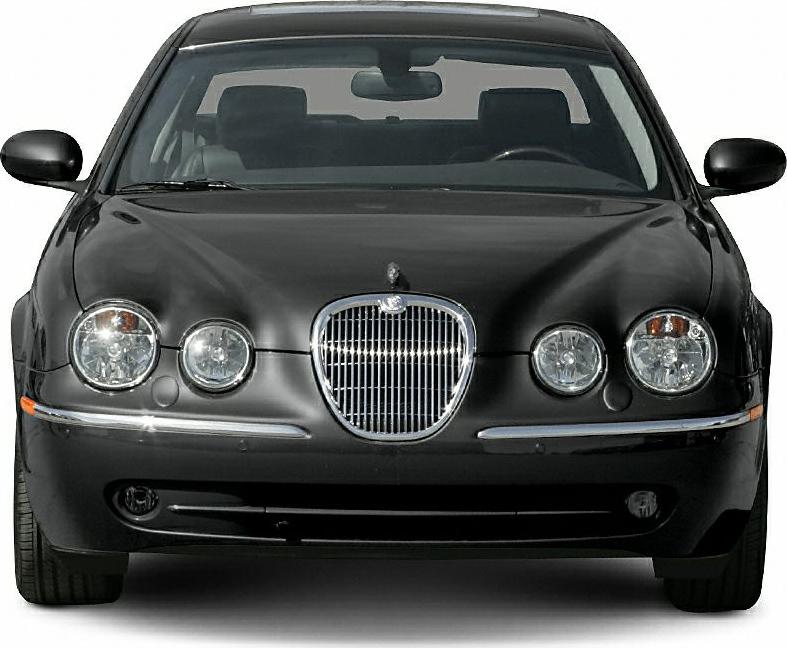 Front view with chrome grille and quad round headlights