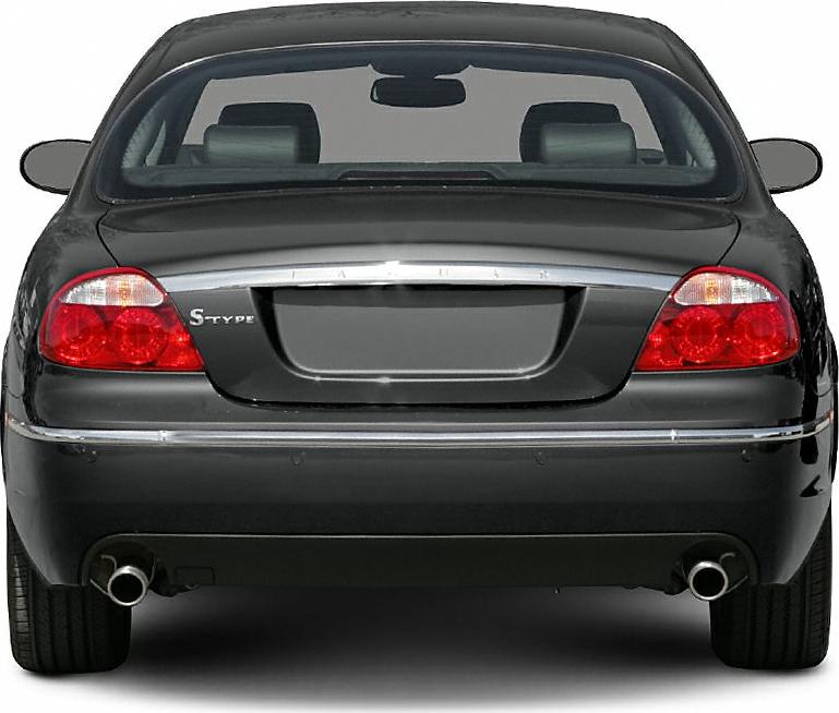 Rear view with tail lights, chrome trim, dual exhaust pipes.