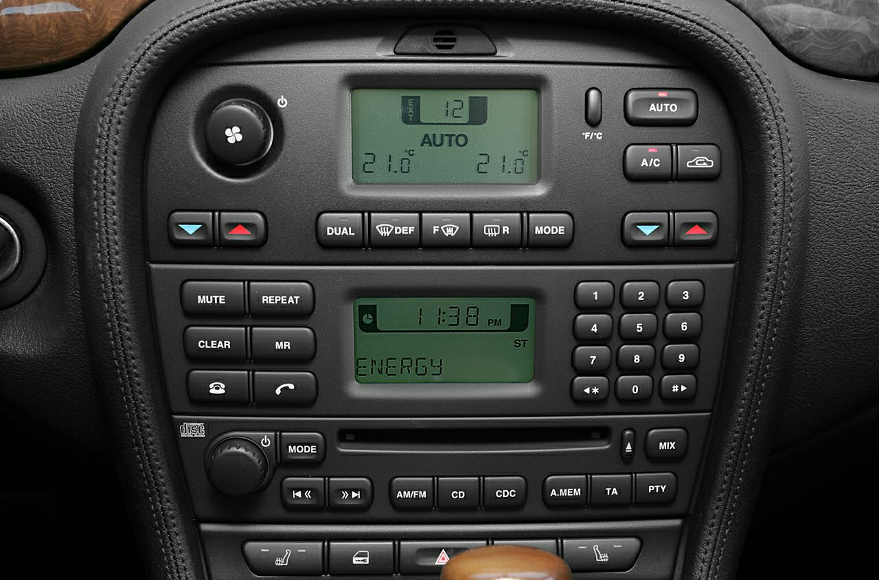 Digital climate control and radio interface with multifunction buttons