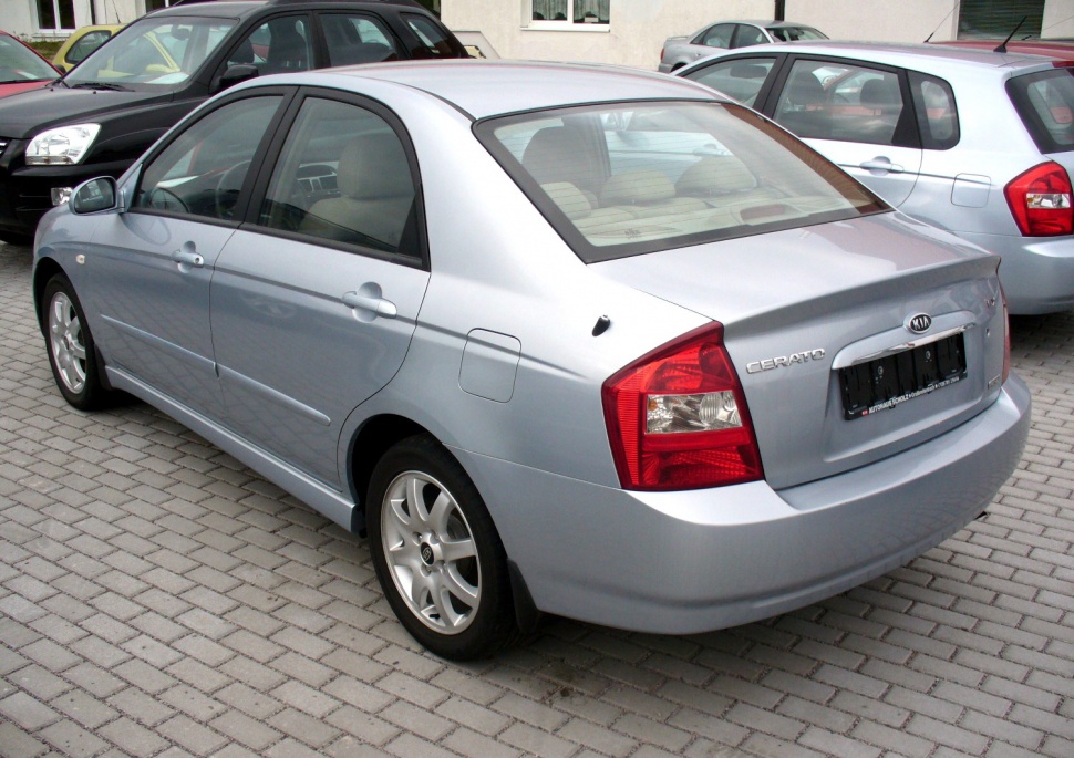 Silver sedan rear side with tail lights and alloy wheels