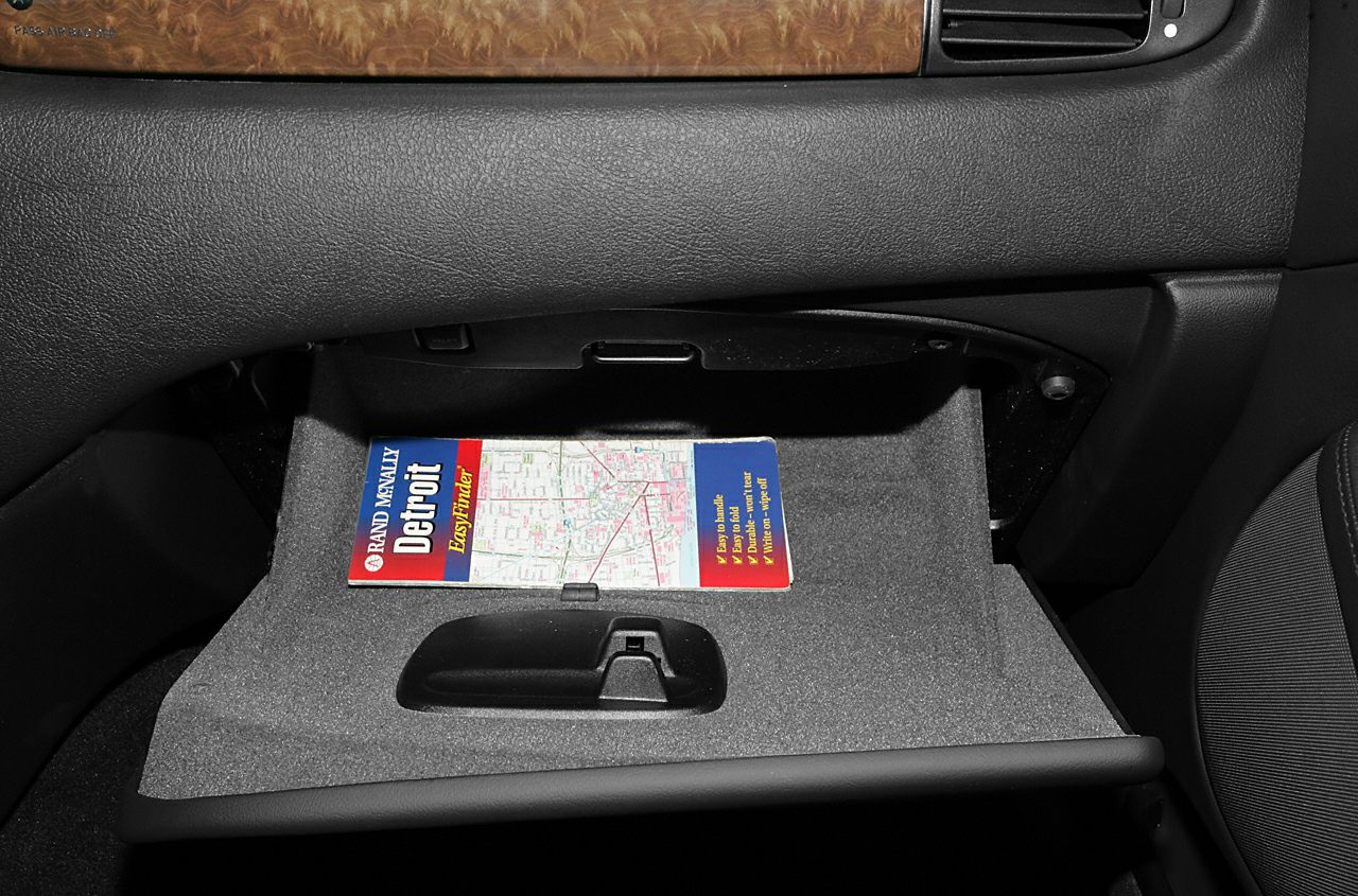 Glove compartment with wood trim and dashboard section