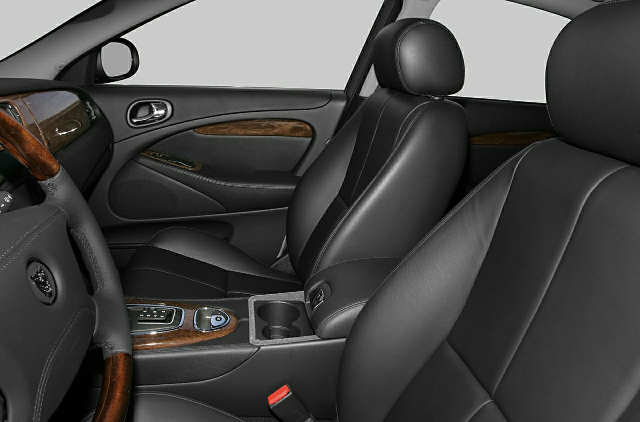 Luxury black leather seats and wood trim center console interior