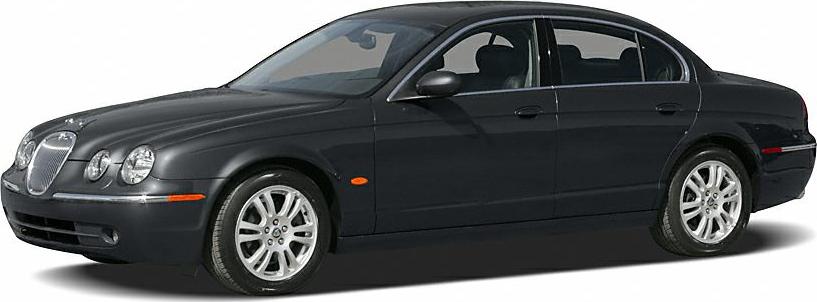 Luxury sedan with rounded quad headlights and chrome grille