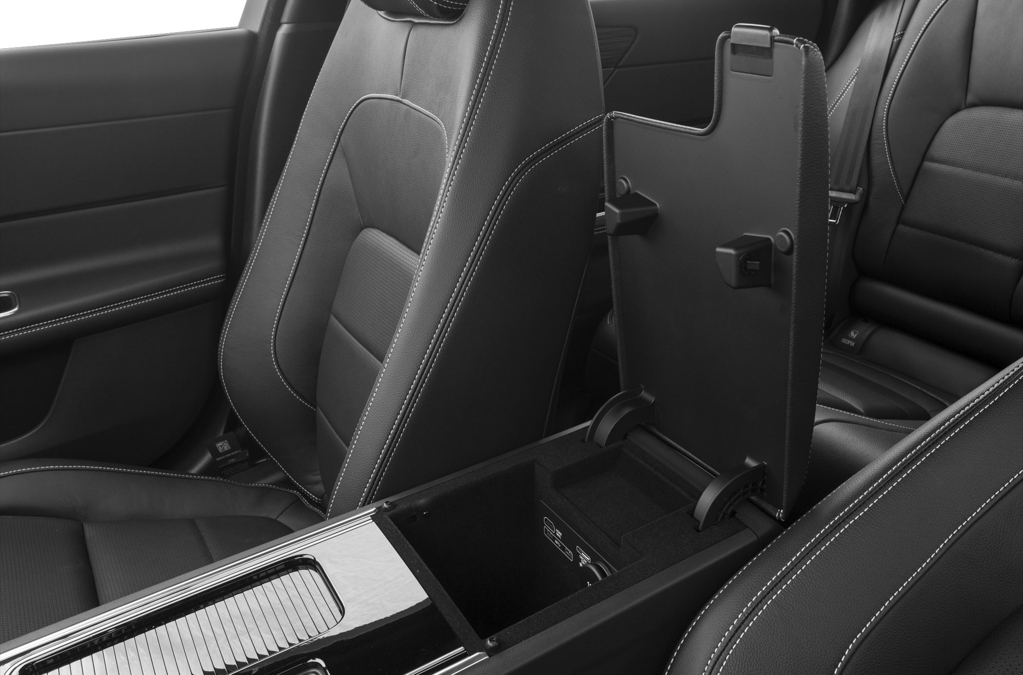 Open center console storage and black leather seats with contrast stitching