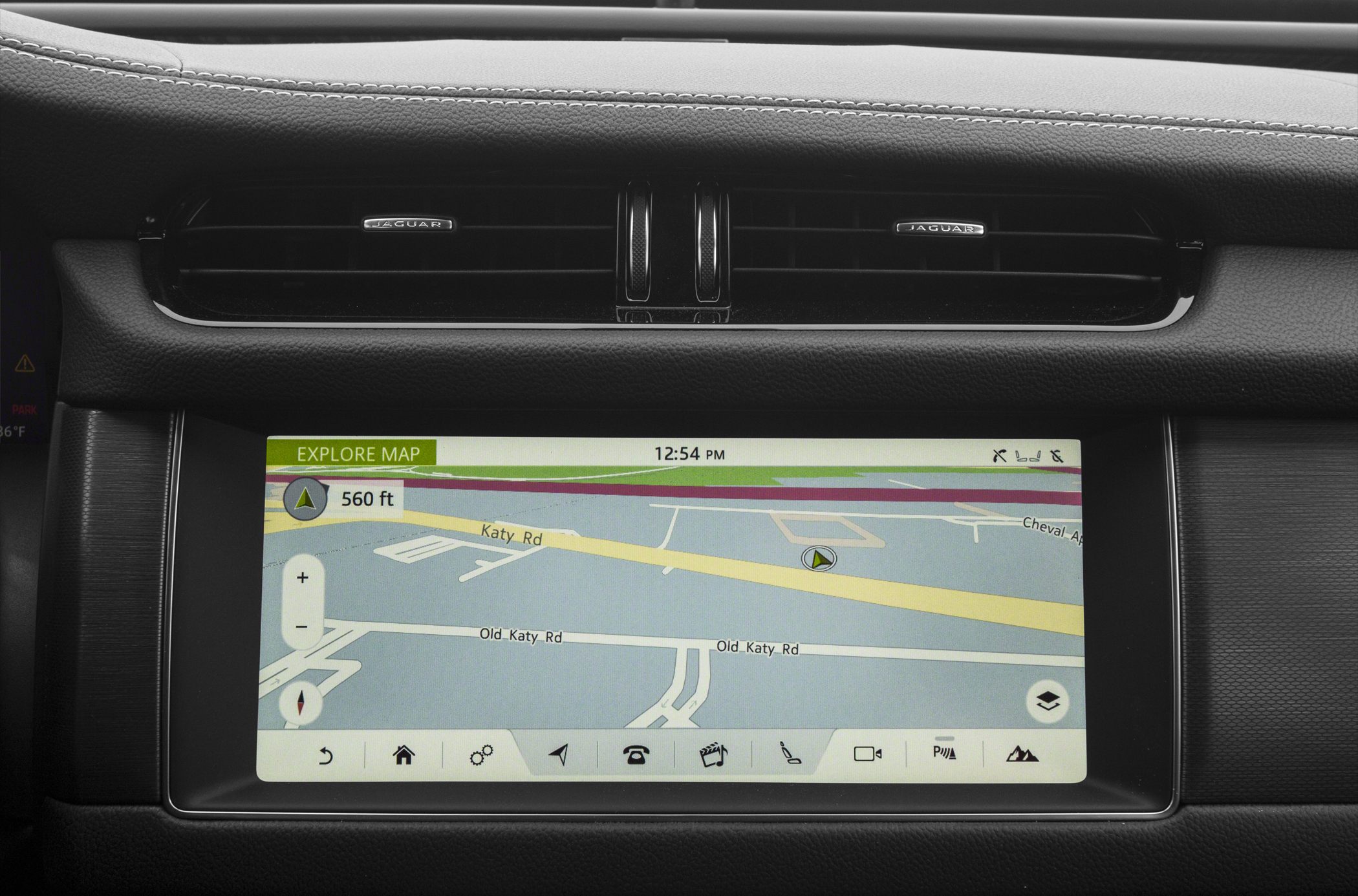 Touchscreen navigation display with control icons in car dashboard