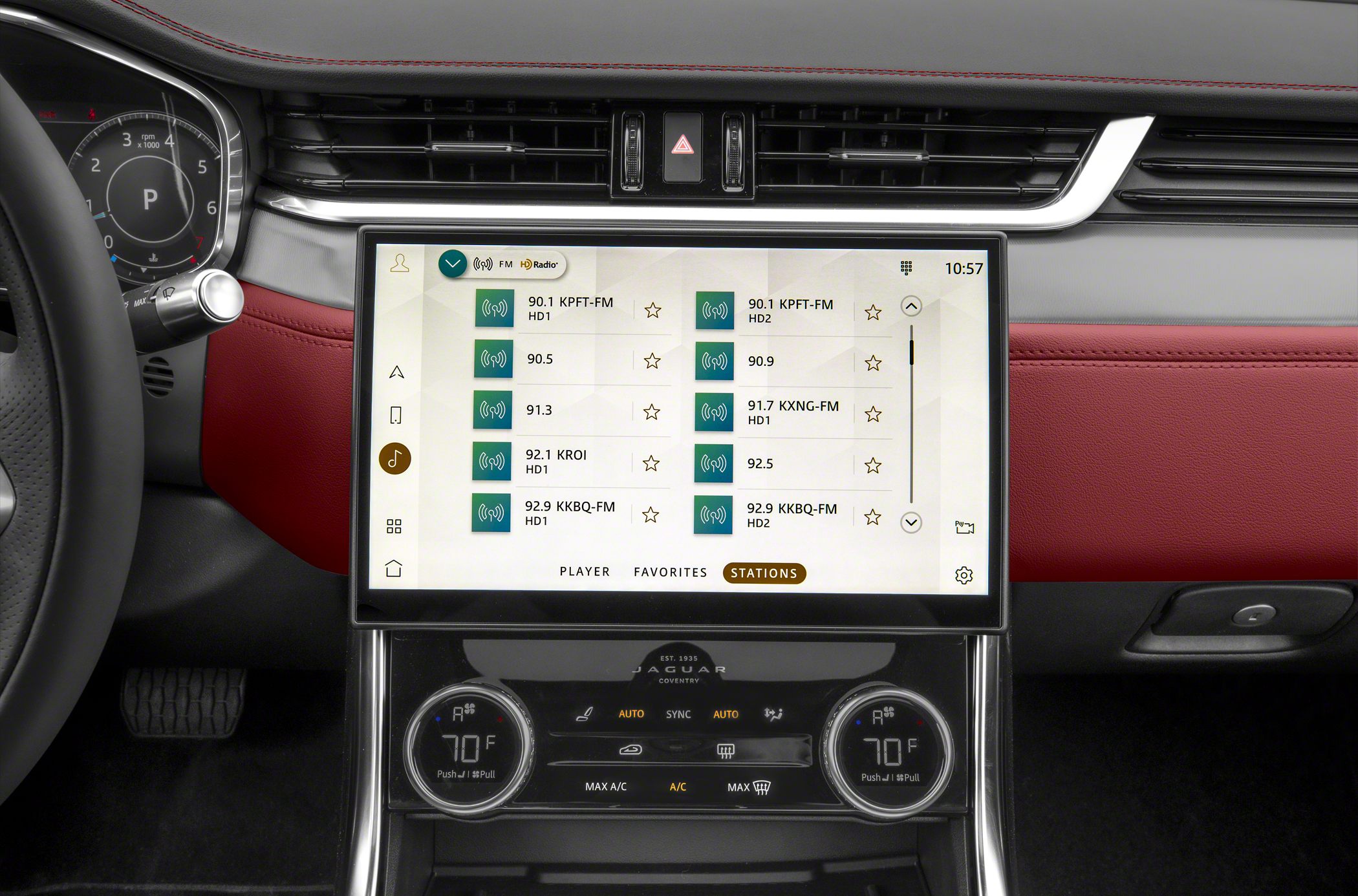 Touchscreen infotainment with radio stations and dual-zone climate control dials