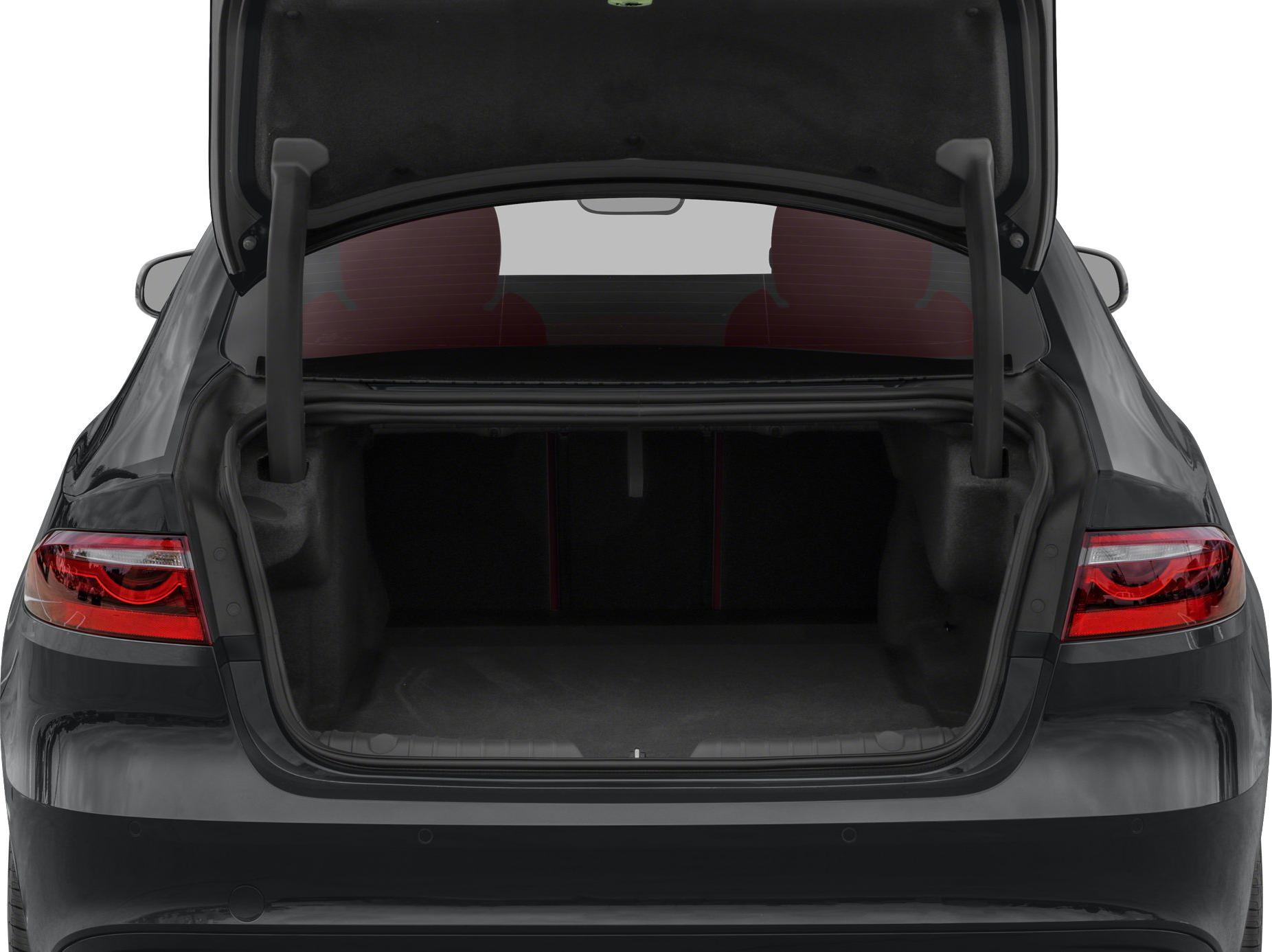 Rear view of luxury sedan with open trunk and taillights