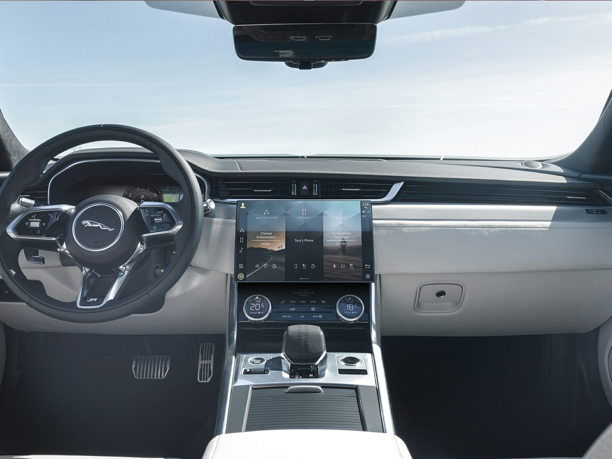 Luxury car dashboard with digital touchscreen and climate controls