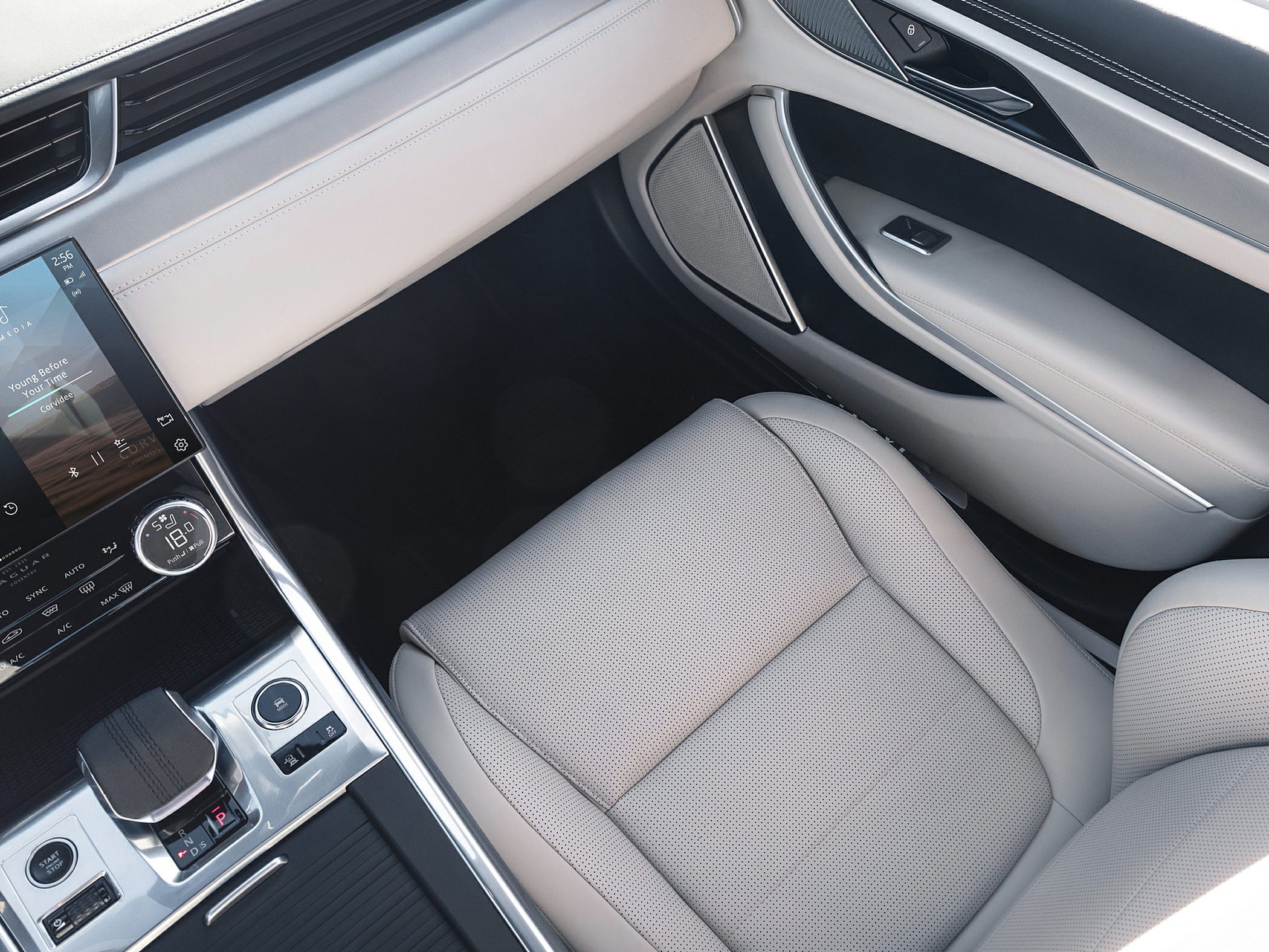 Beige leather front passenger seat with digital center console