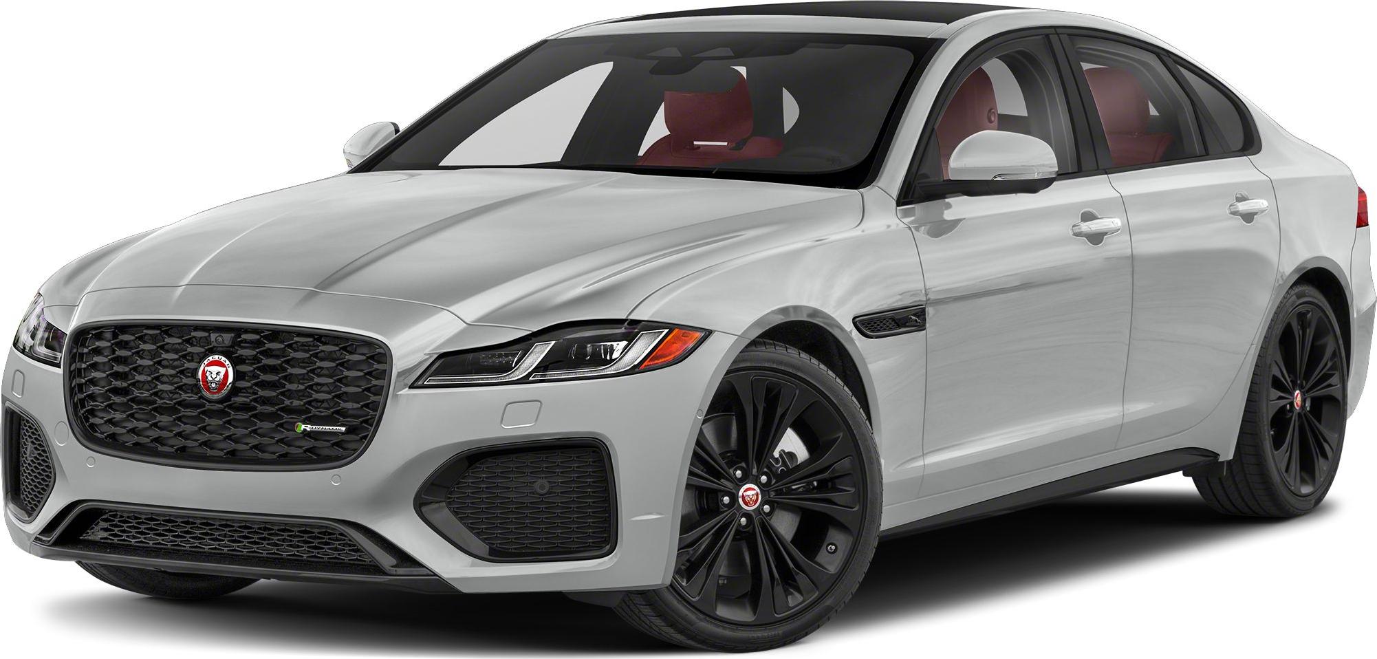 Front three-quarter view of white luxury sedan with black wheels and distinctive grille