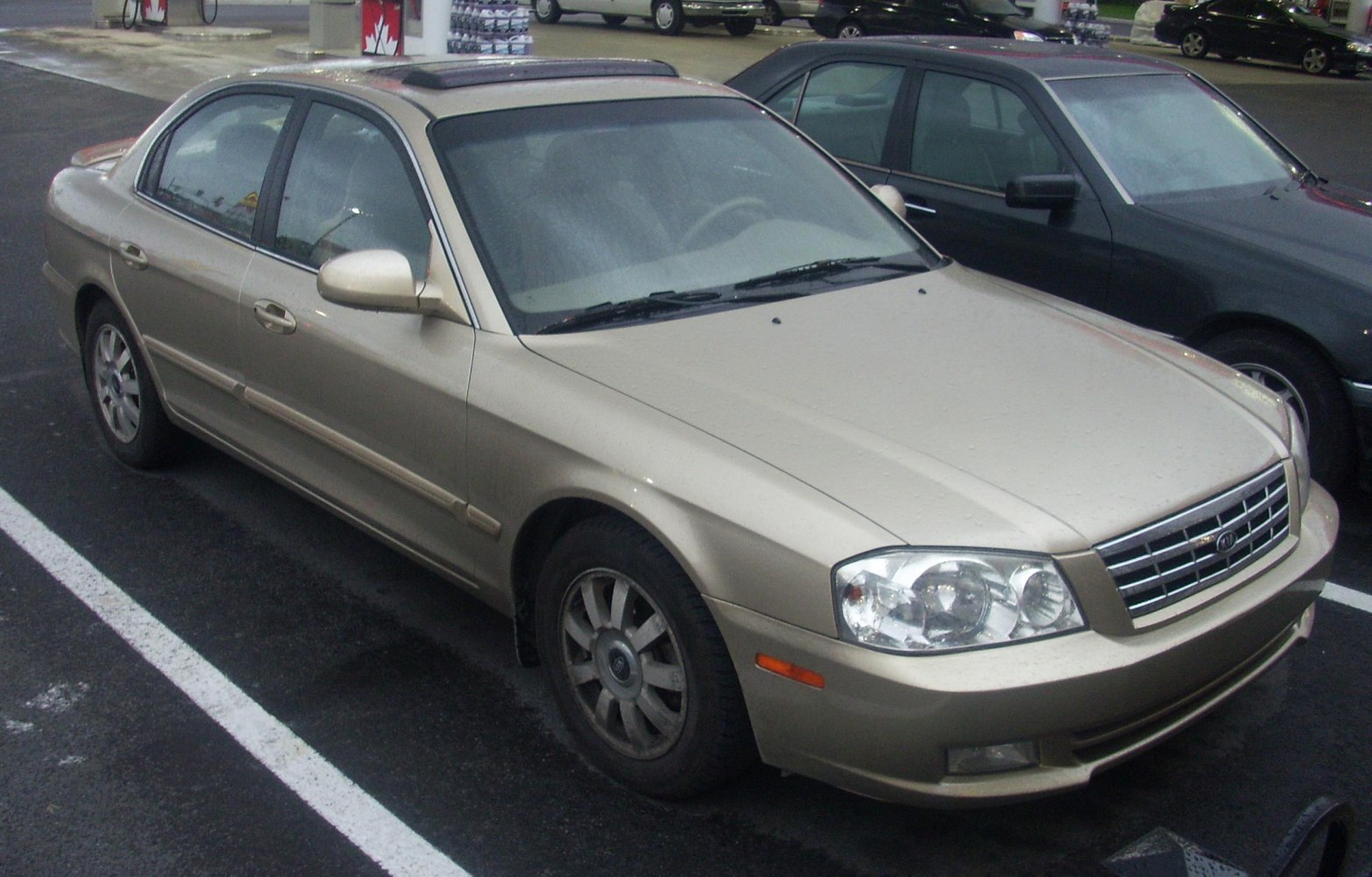 Front side view of a mid-size sedan with sunroof and alloy wheels