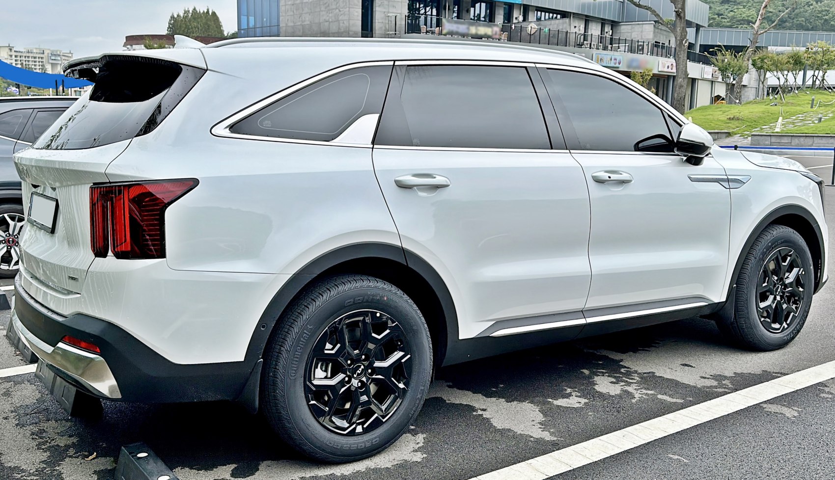 Rear and side view of SUV with black alloy wheels and tinted windows