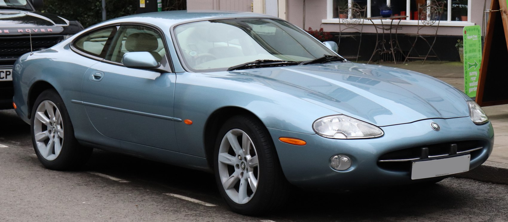 Sleek front side view with aerodynamic body and alloy wheels
