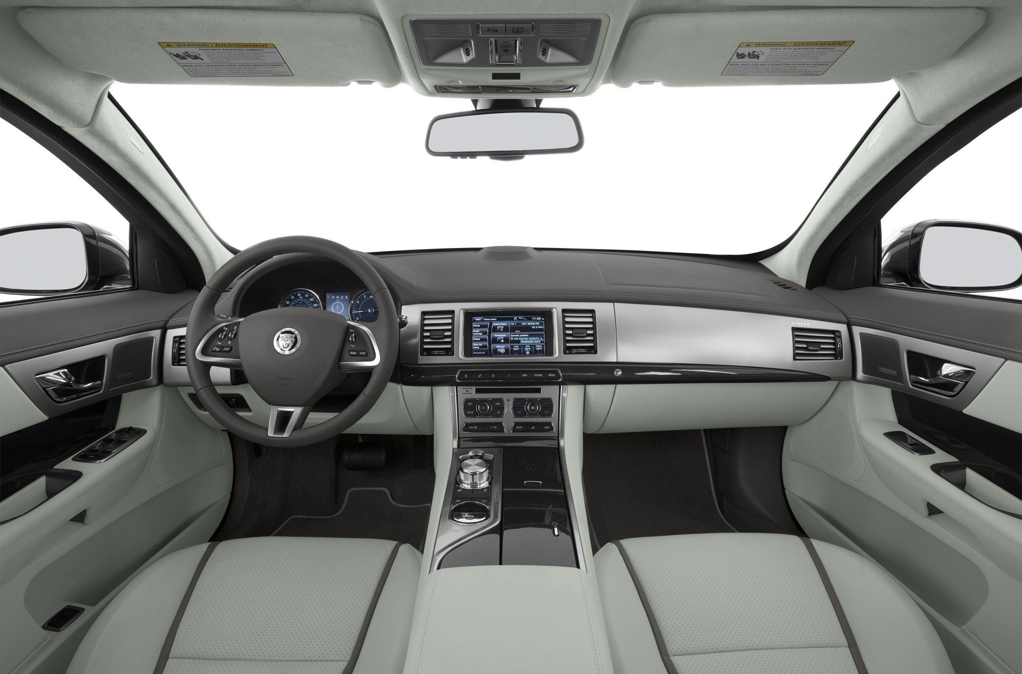 Car interior with dashboard, steering wheel, touchscreen, and light leather seats.