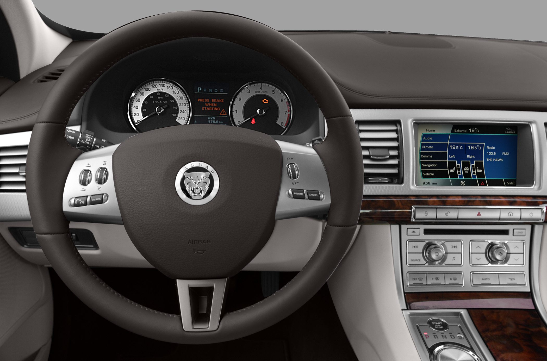 Leather steering wheel and digital dashboard with climate control and infotainment screen