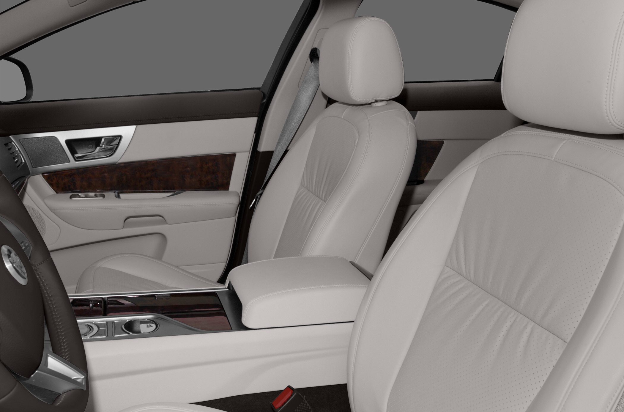 Beige leather front seats with wood-trimmed center console interior