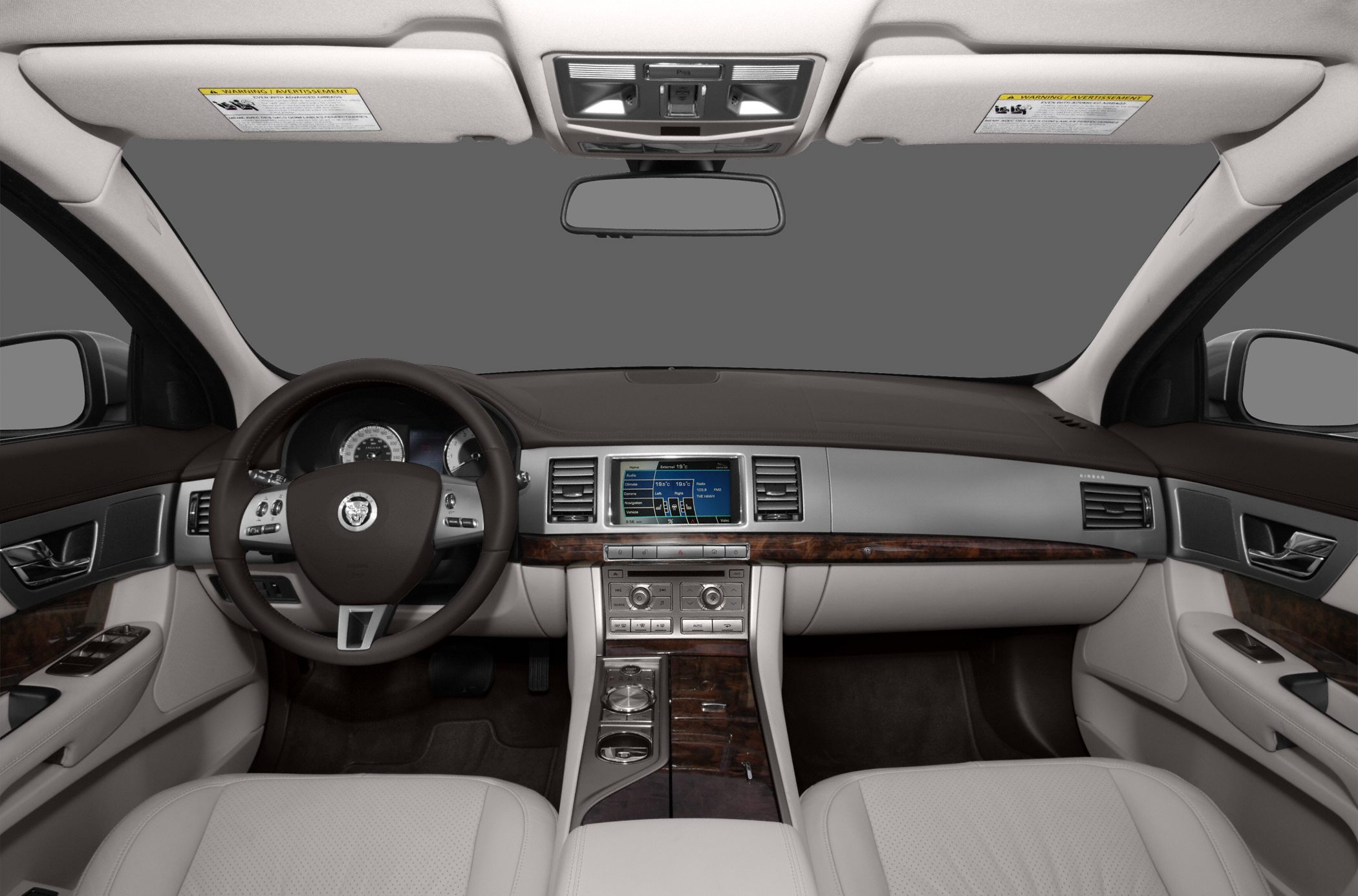 Luxury car interior with wood-trim dashboard and navigation display