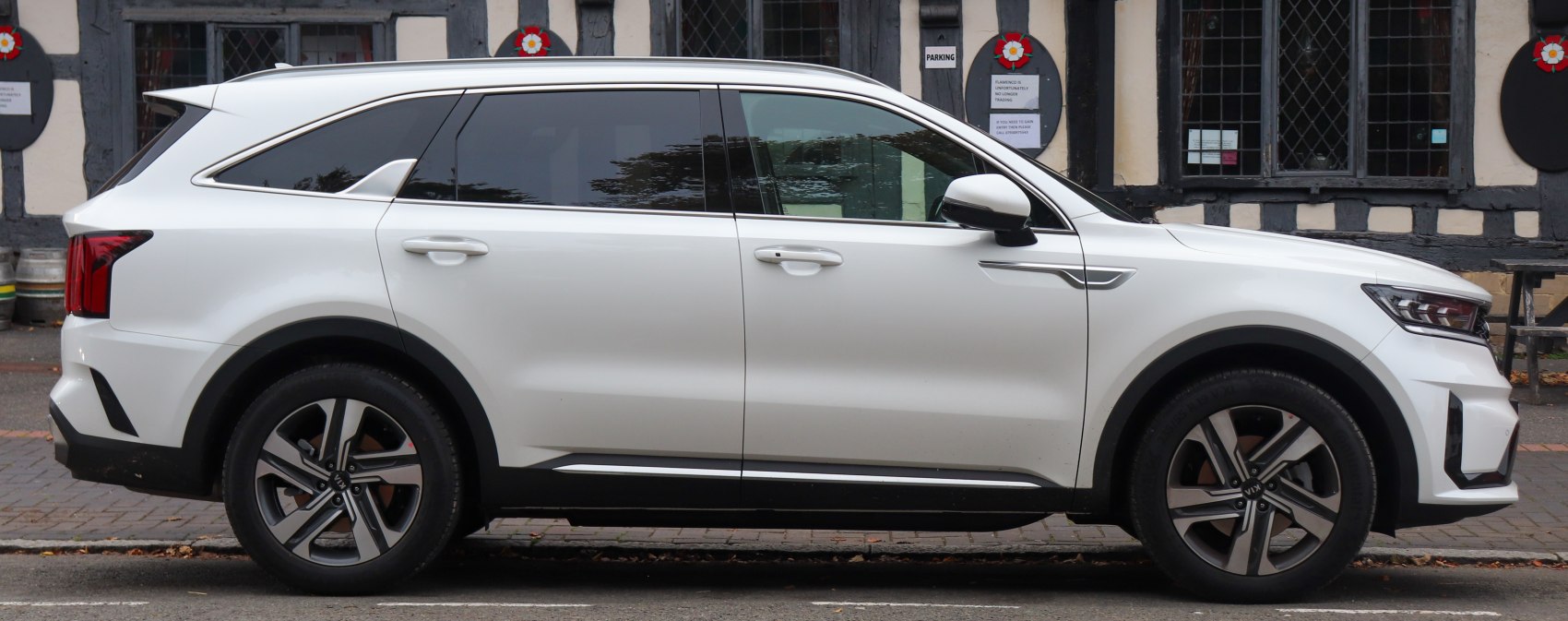 Side profile of a modern SUV with alloy wheels and tinted windows