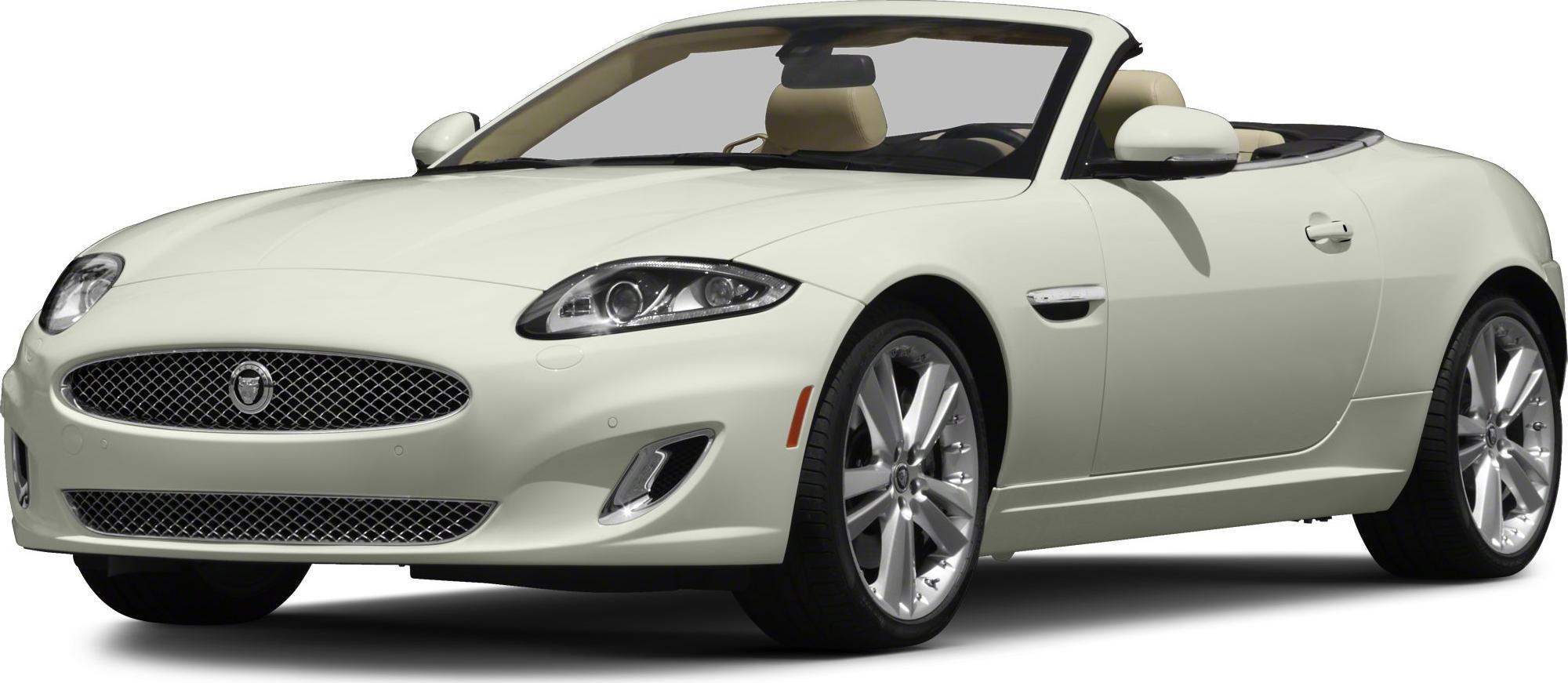Front side view of white luxury convertible with headlights and alloy wheels