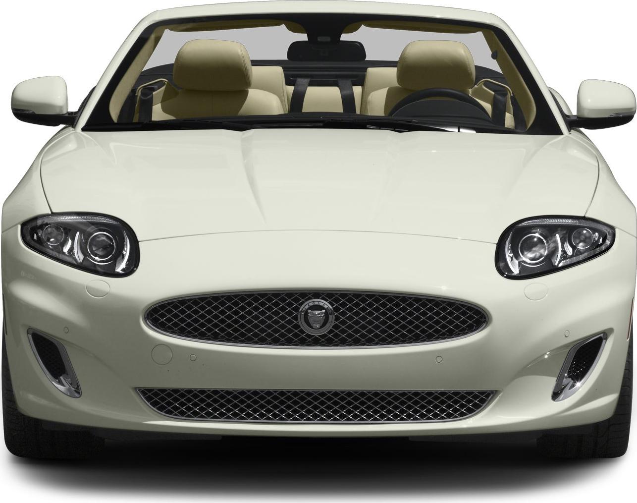 Front view of convertible with distinct grill and headlights, beige interior visible
