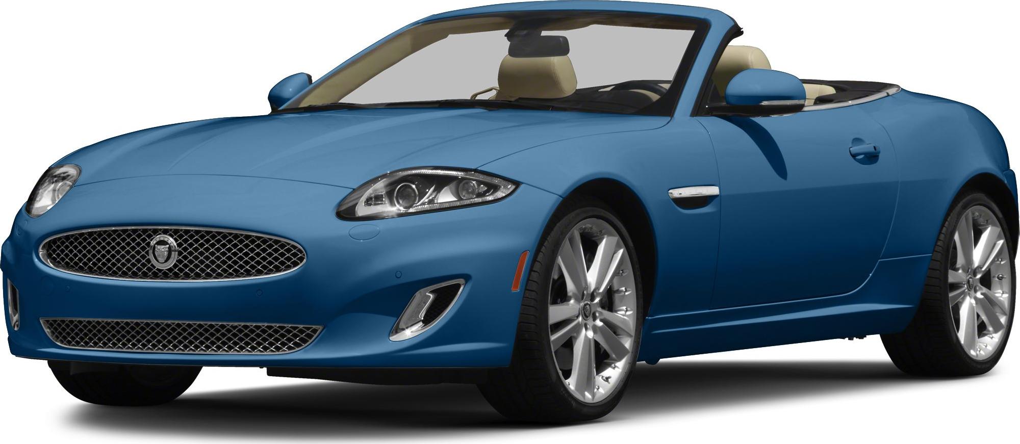 Blue convertible luxury roadster with beige interior and sporty design.