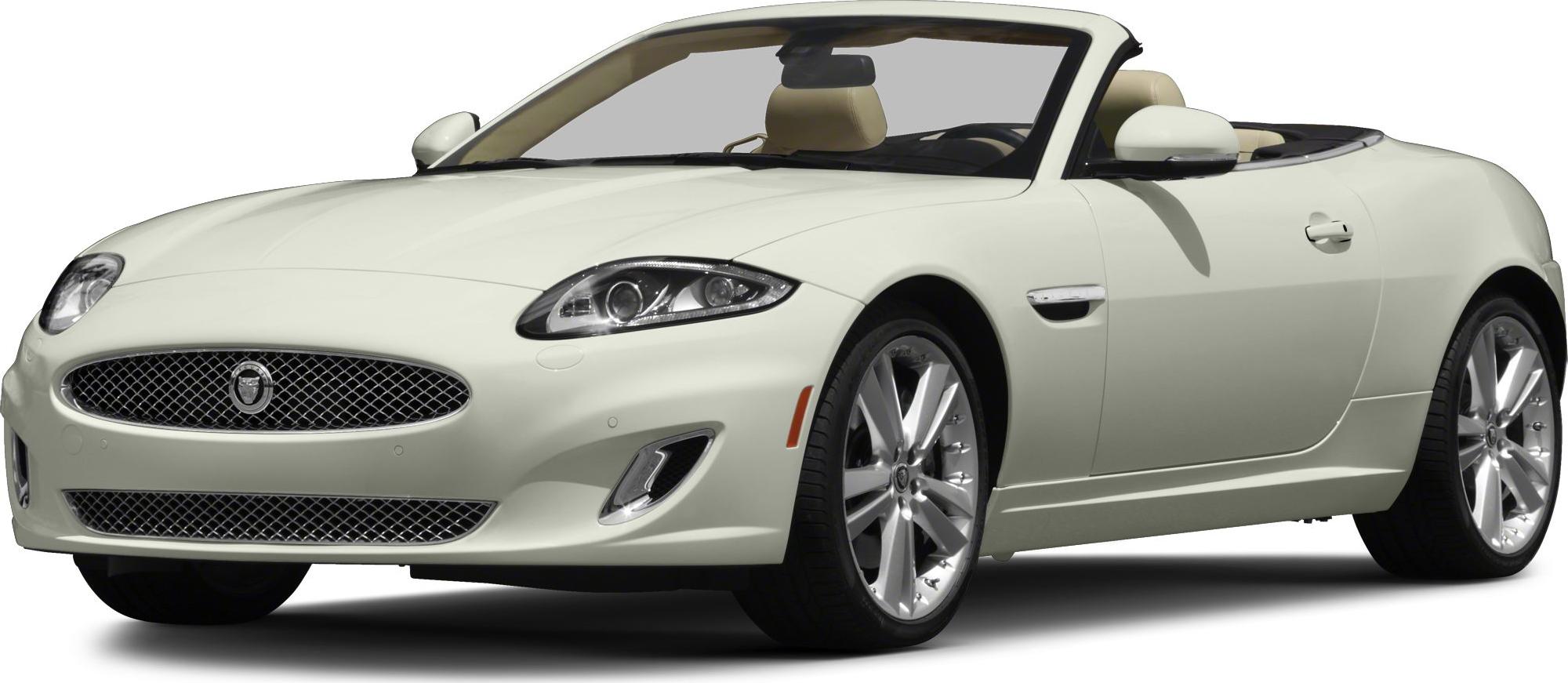 Front view of sleek convertible with mesh grille and beige leather interior