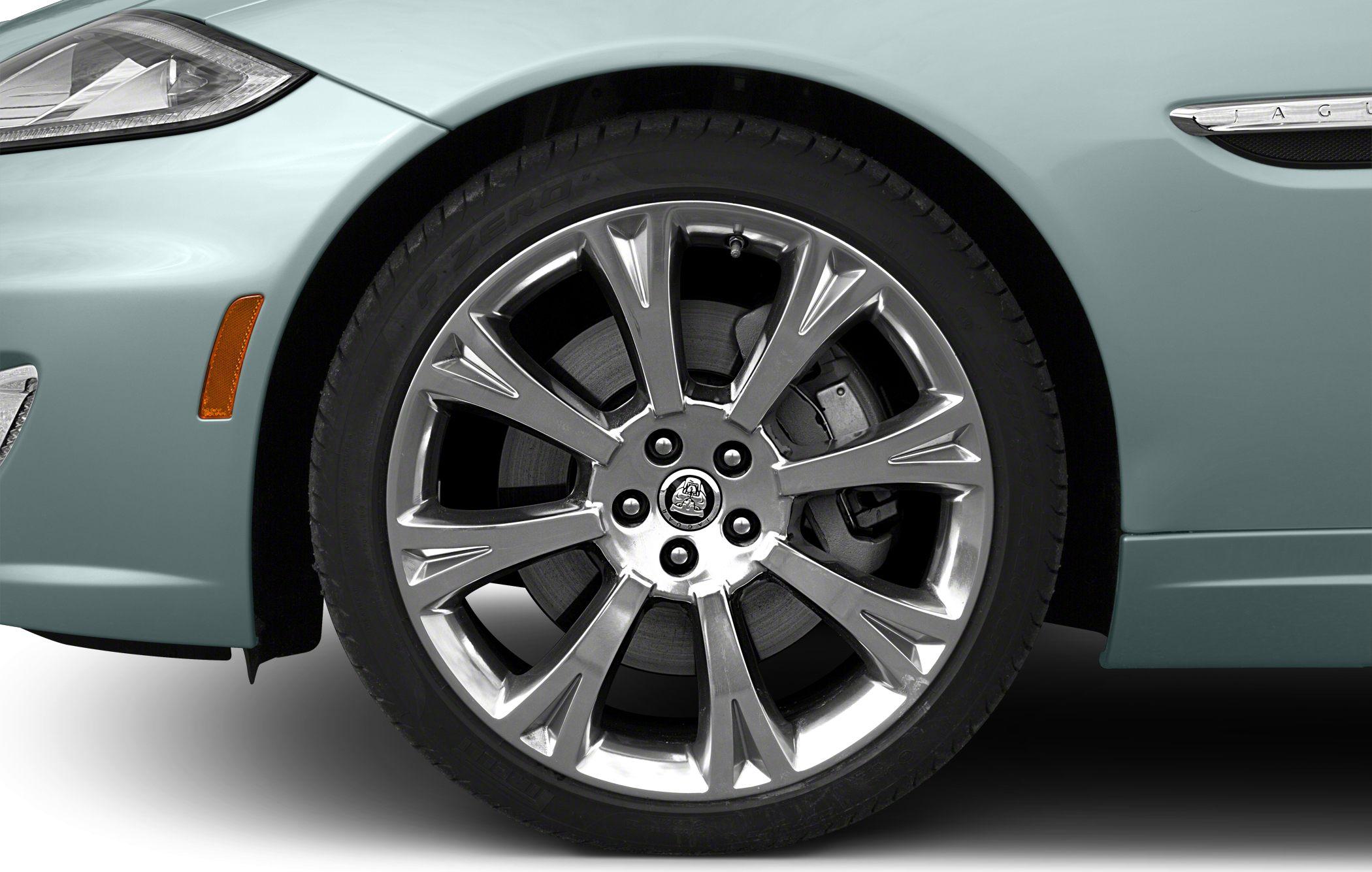Close-up of alloy wheel and front fender of a luxury coupe