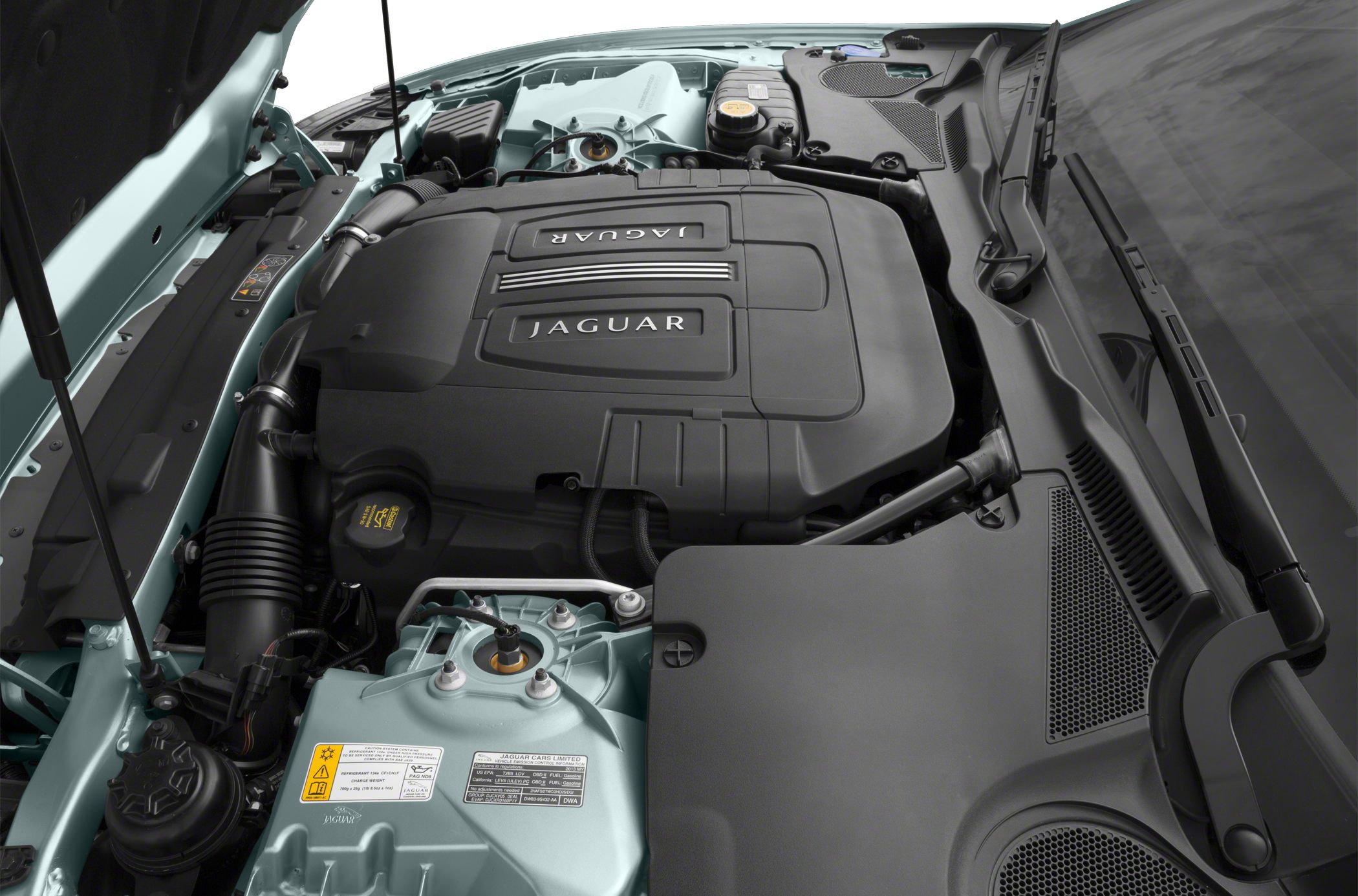 Engine bay with Jaguar branded engine cover and mechanical components