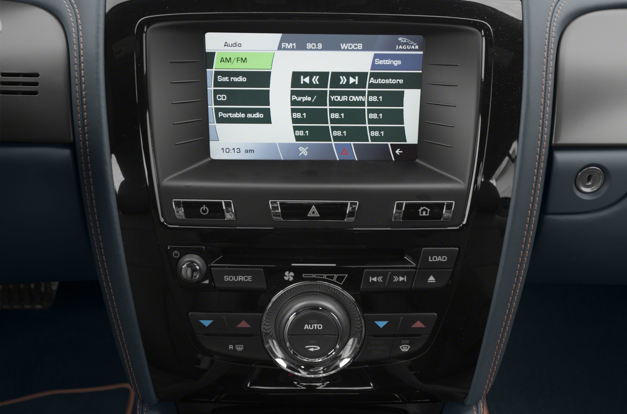 Infotainment screen and climate control console with radio and media options