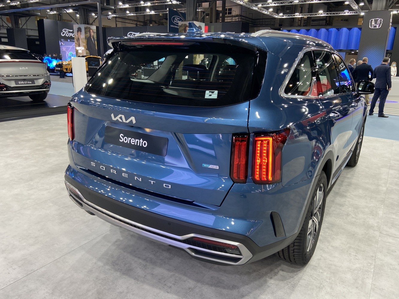 SUV rear with vertical LED taillights and hybrid badge