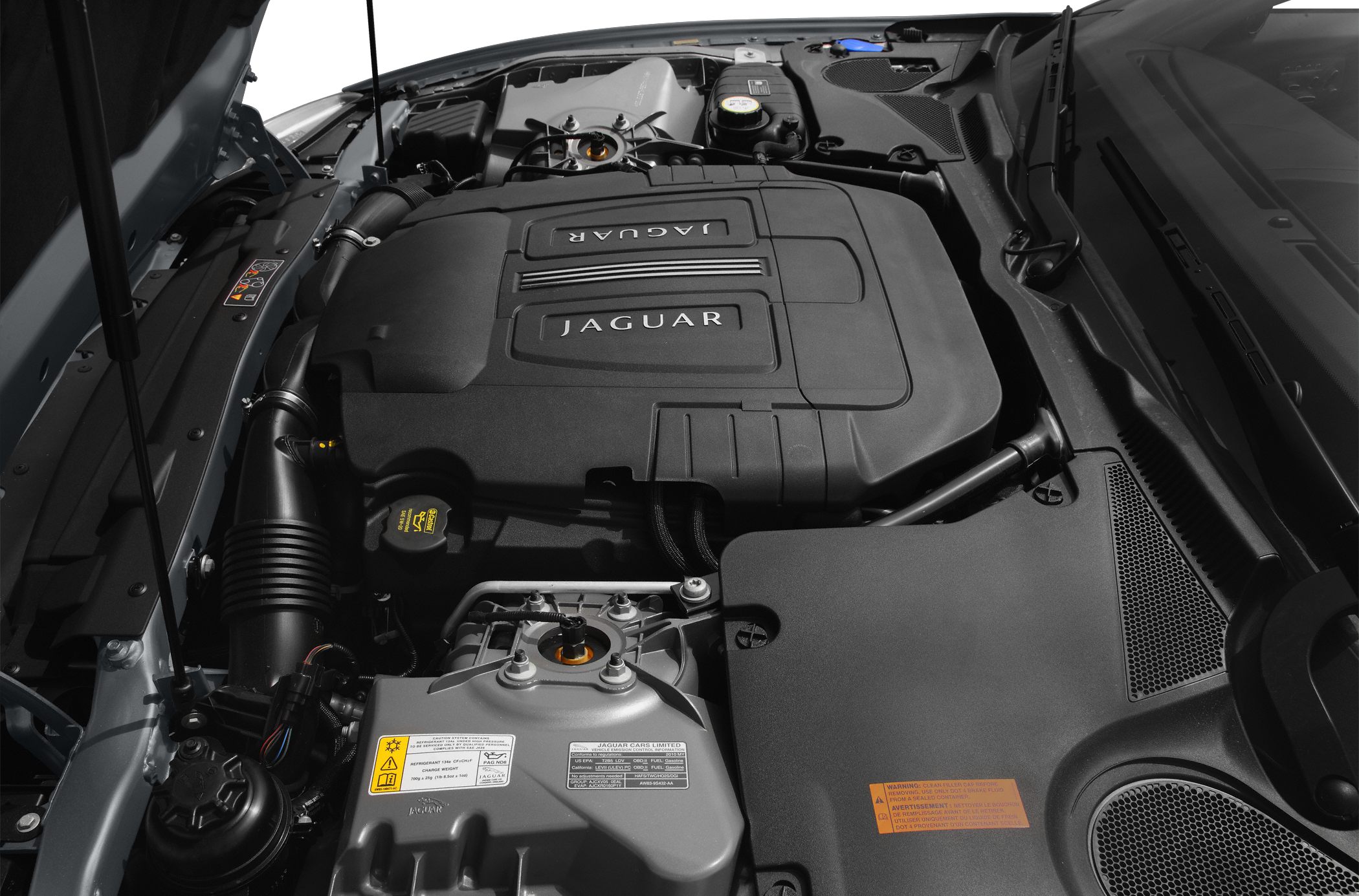 Close-up of Jaguar XK Convertible engine bay with prominent engine cover.