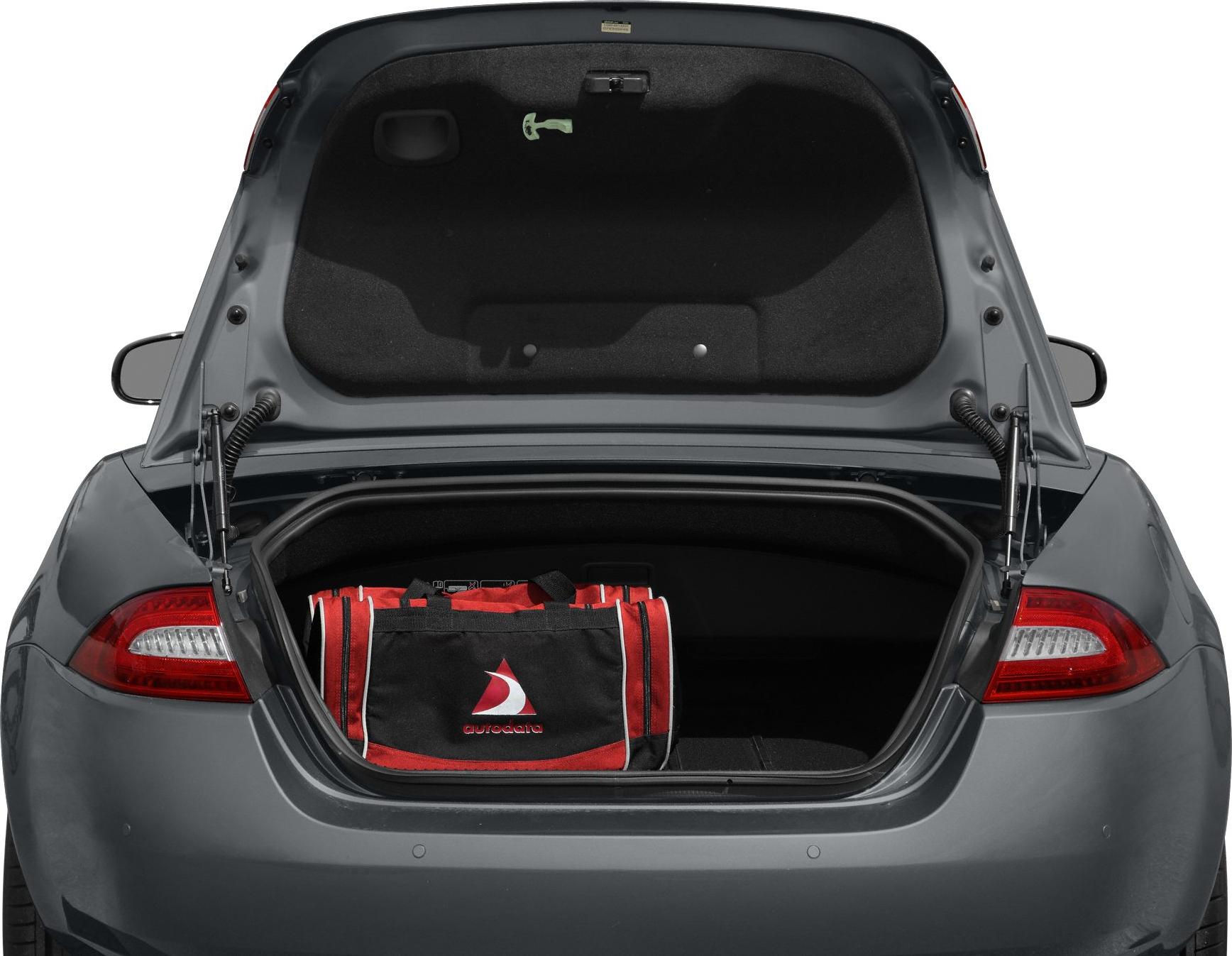 Open trunk of a convertible car with a bag inside