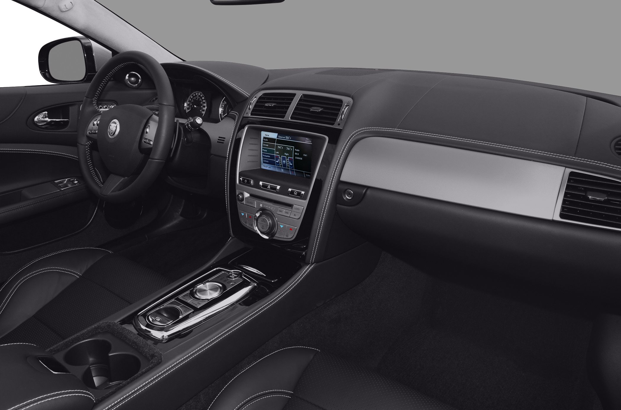 Luxury convertible infotainment dashboard and leather interior with control dial and touchscreen display