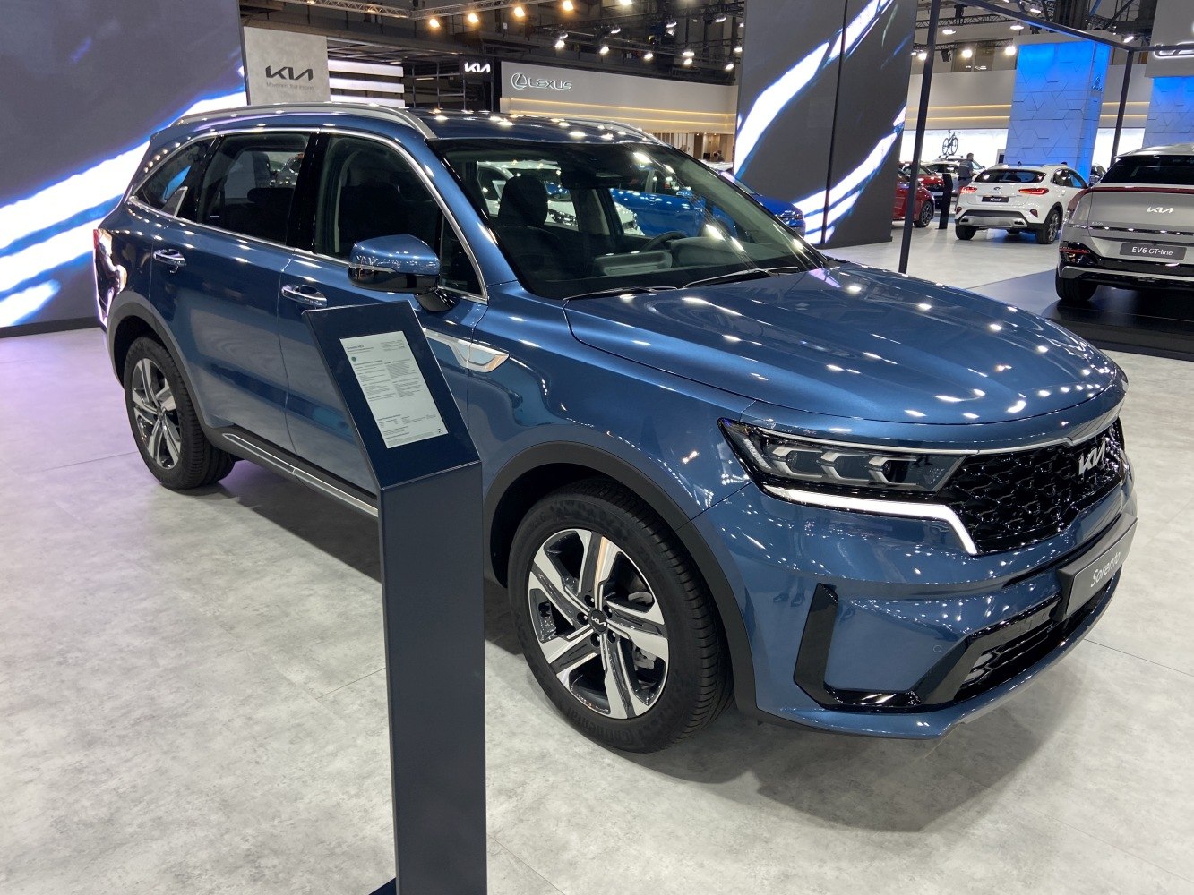 Blue mid-size SUV with modern LED headlights and alloy wheels