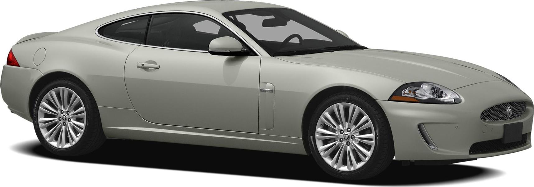 Silver sleek coupe with alloy wheels and smooth aerodynamic lines.