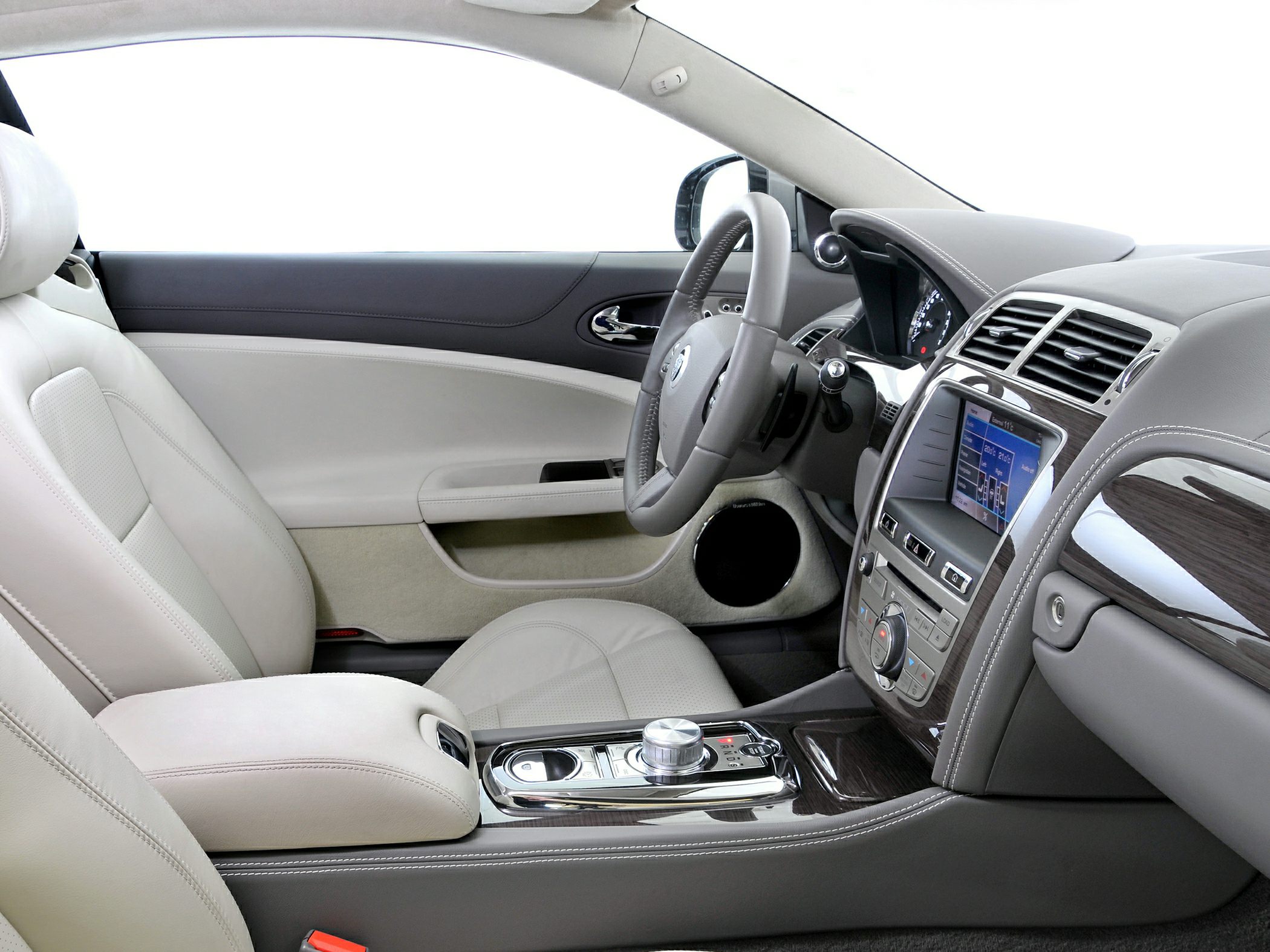 Beige leather seats with wood trim and digital display