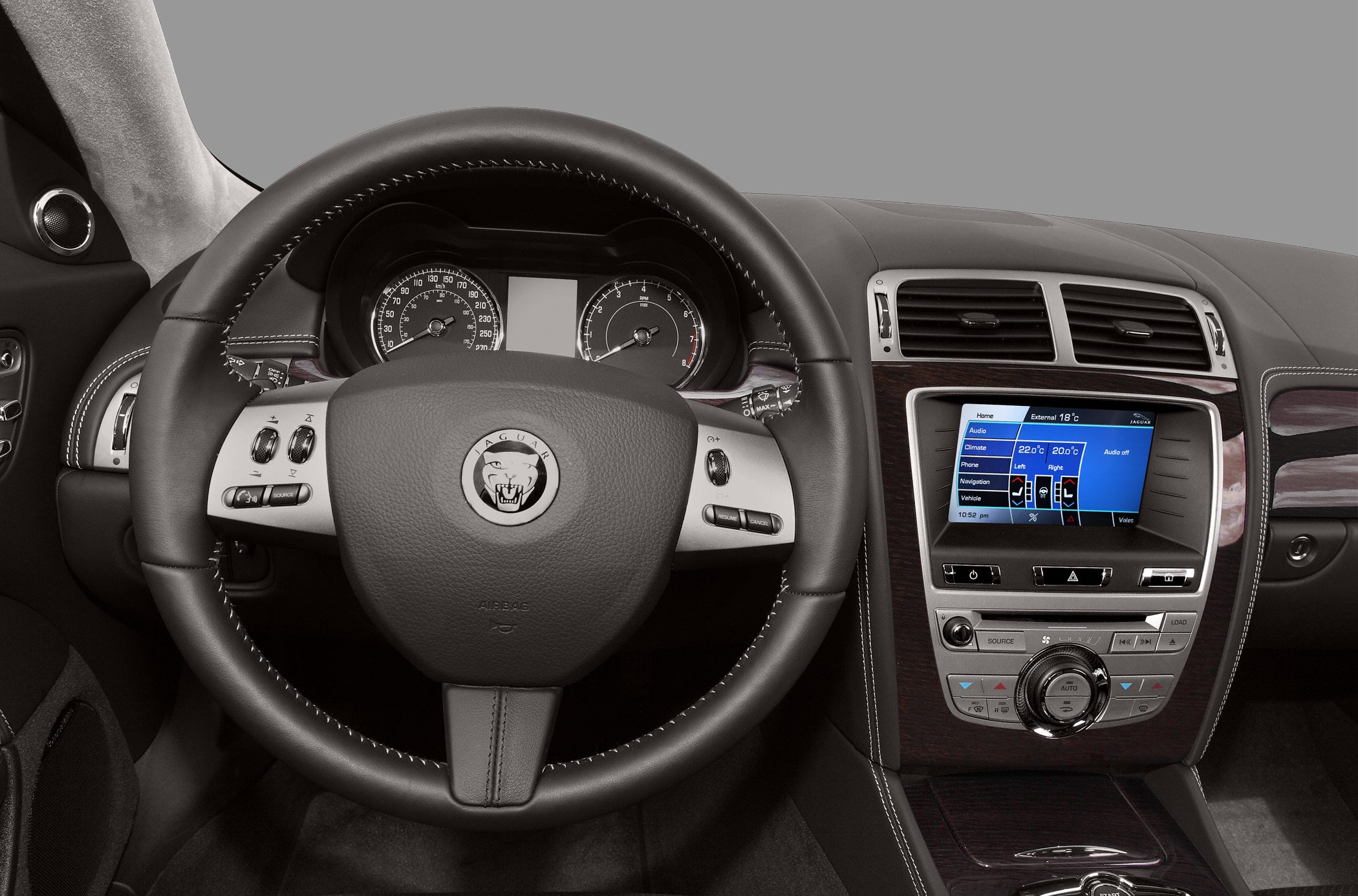 Leather steering wheel and dashboard with digital display and wood trim